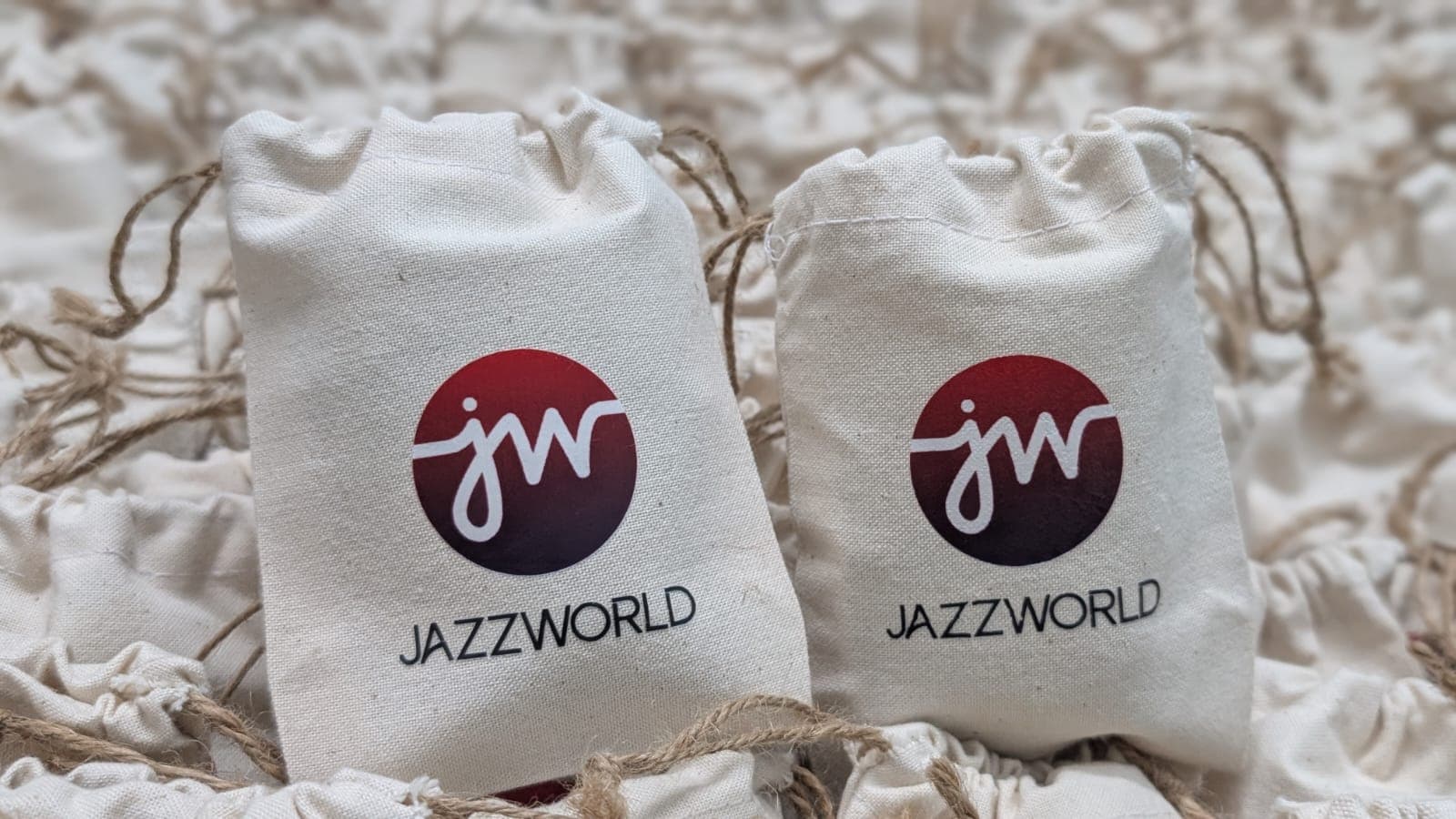 Close-up of two JazzWorld branded cotton seed-ball bags